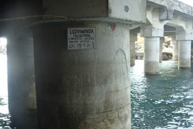 Retrofitted tubular piles with concrete jacket