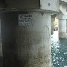 Retrofitted tubular piles with concrete jacket